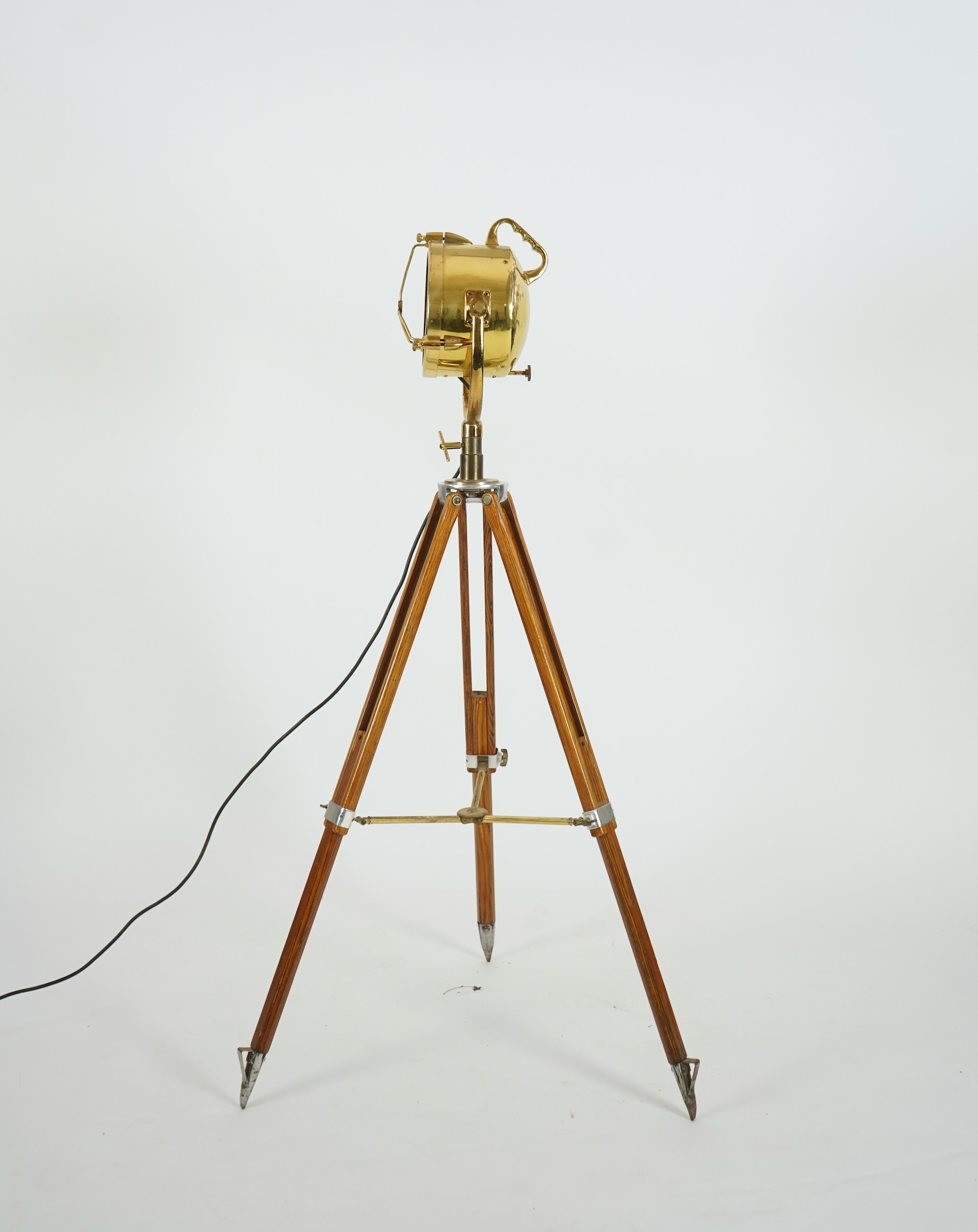 A mid 20th century polished brass marine searchlight